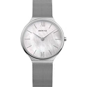 A silver Bering watch with a mesh strap and a white dial with Roman numerals.