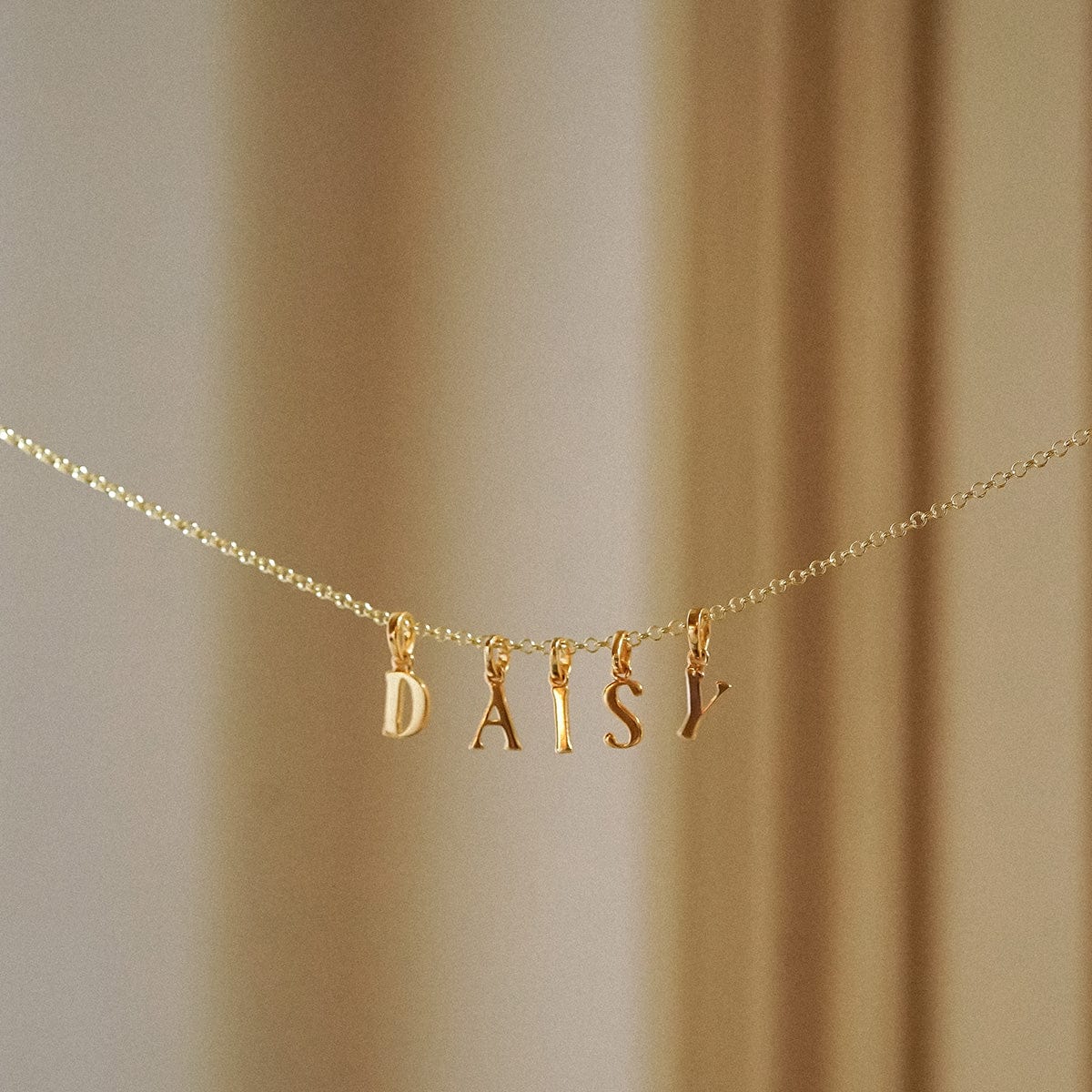 personalised-initial-charm-pendant-18ct-gold-plate-necklaces-daisy-london-jewellery-1197805148_1944x_b490a8e3-807a-4708-aa27-fa102894d78f.jpg